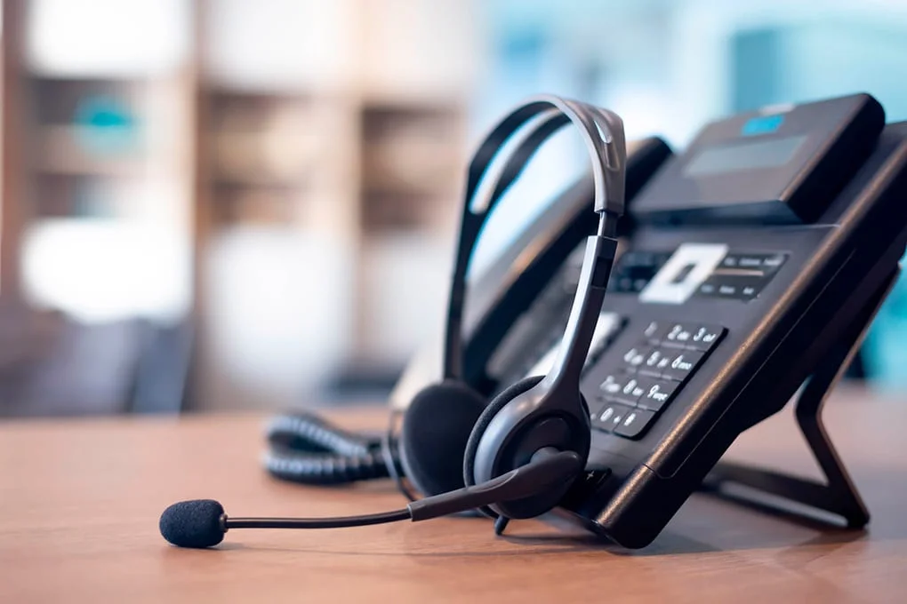 telephone and headphones: VoIP systems. 