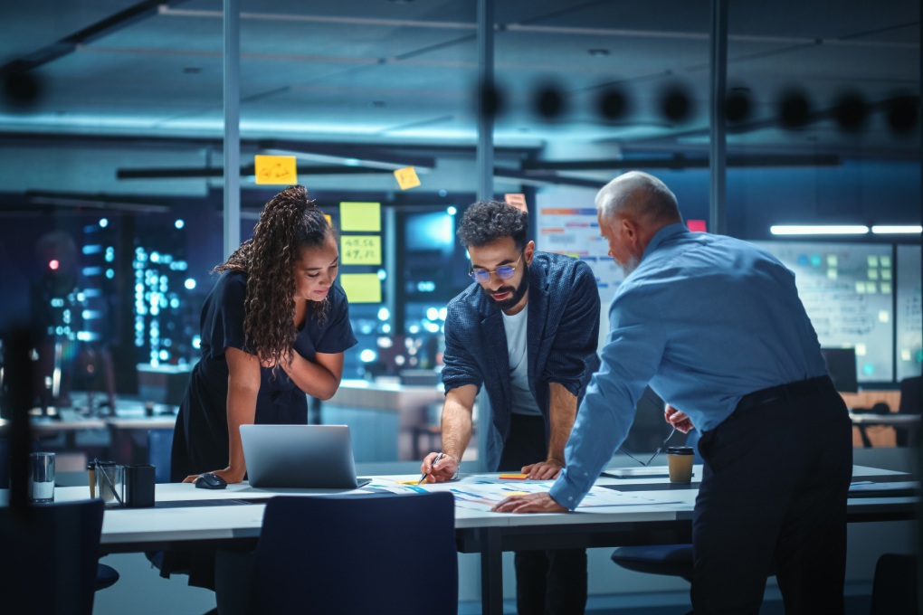 Office Conference Room Meeting: Diverse Team of Top Managers Talk, Brainstorm, Use Digital Tablet. Business Partners Discuss Financial Reports, Plan Investment Strategy. Team of Three