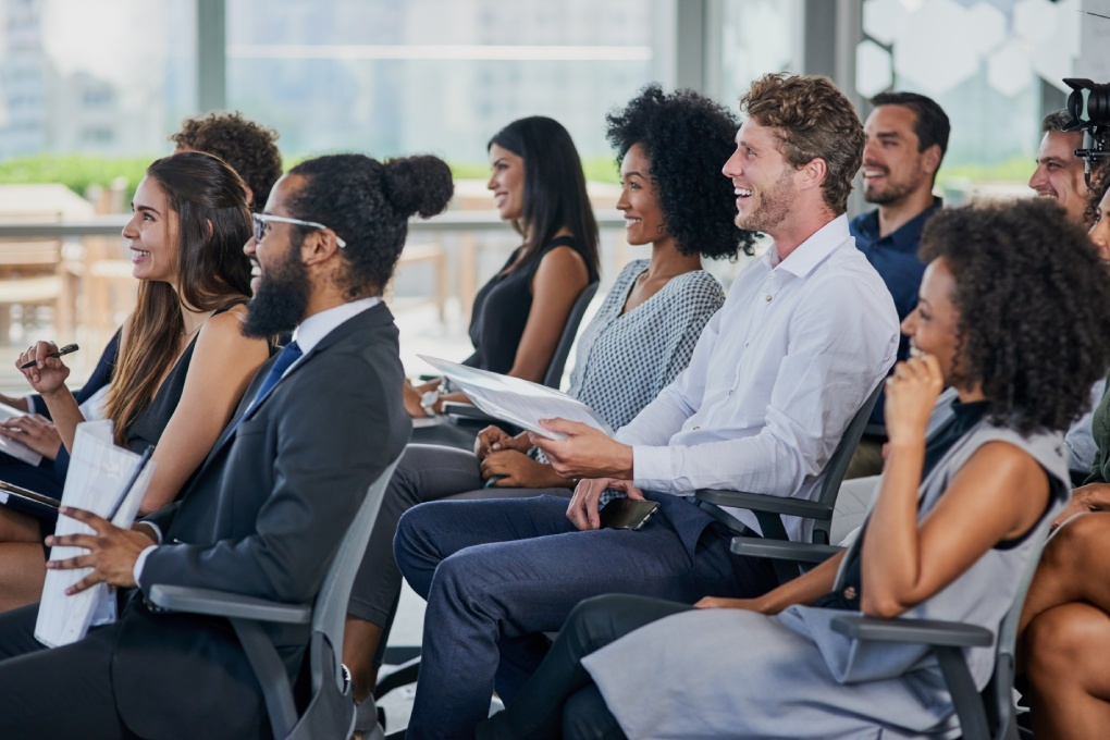 Corporate, development and seminar with business people in conference room for learning or training. Education, event or workshop with man and woman employee group in audience or crowd at office