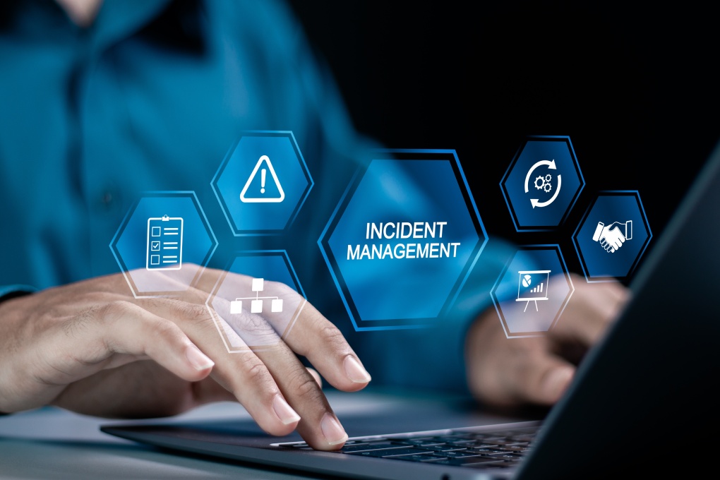 Incident management process business technology concept. Businessman using laptop with incident management icon on virtual screen. diagnosing and resolving unexpected problems that occur.